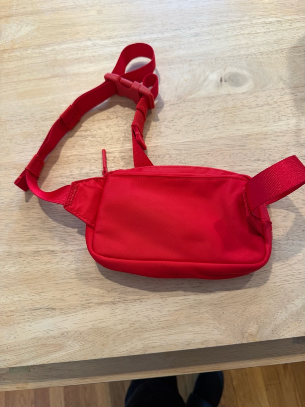 Sleek Red Waist Bag Canada logo